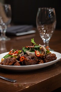 a plate of food on a wooden table