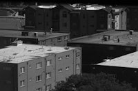 a black and white photo of a group of buildings