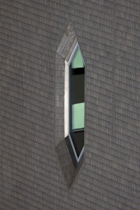 a window in the side of a brick building