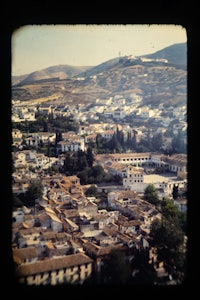 a view of a city from the top of a hill