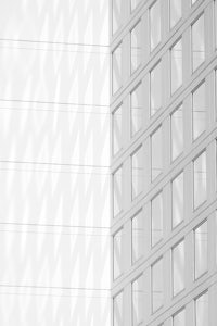a black and white photo of a building with windows