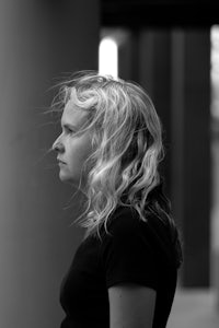 a black and white photo of a woman with long blonde hair