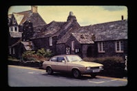 a car is parked in front of a building